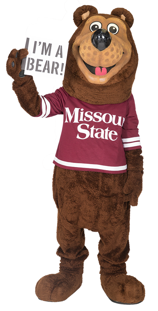 Boomer Bear holding a sign that says, "I'm a Bear!"