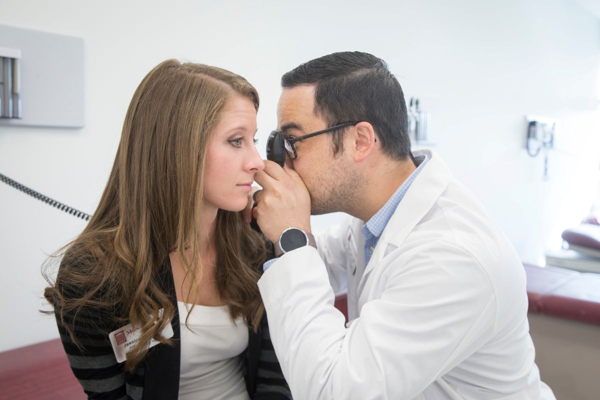 Missouri State nursing students working together on an eye exam in the MCHHS simulation center