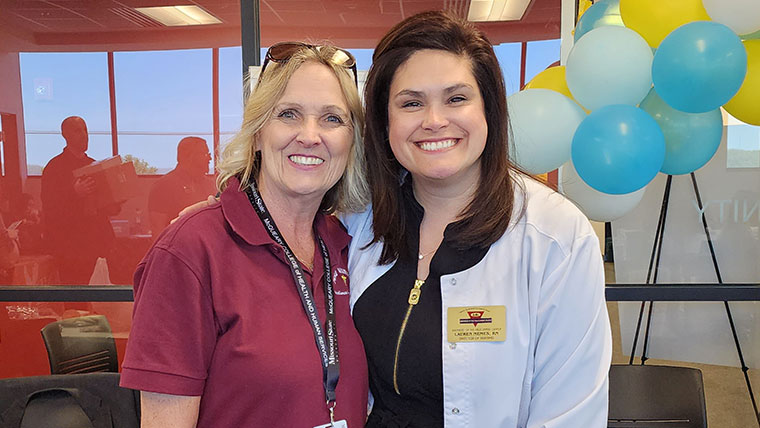 Two smiling nurses