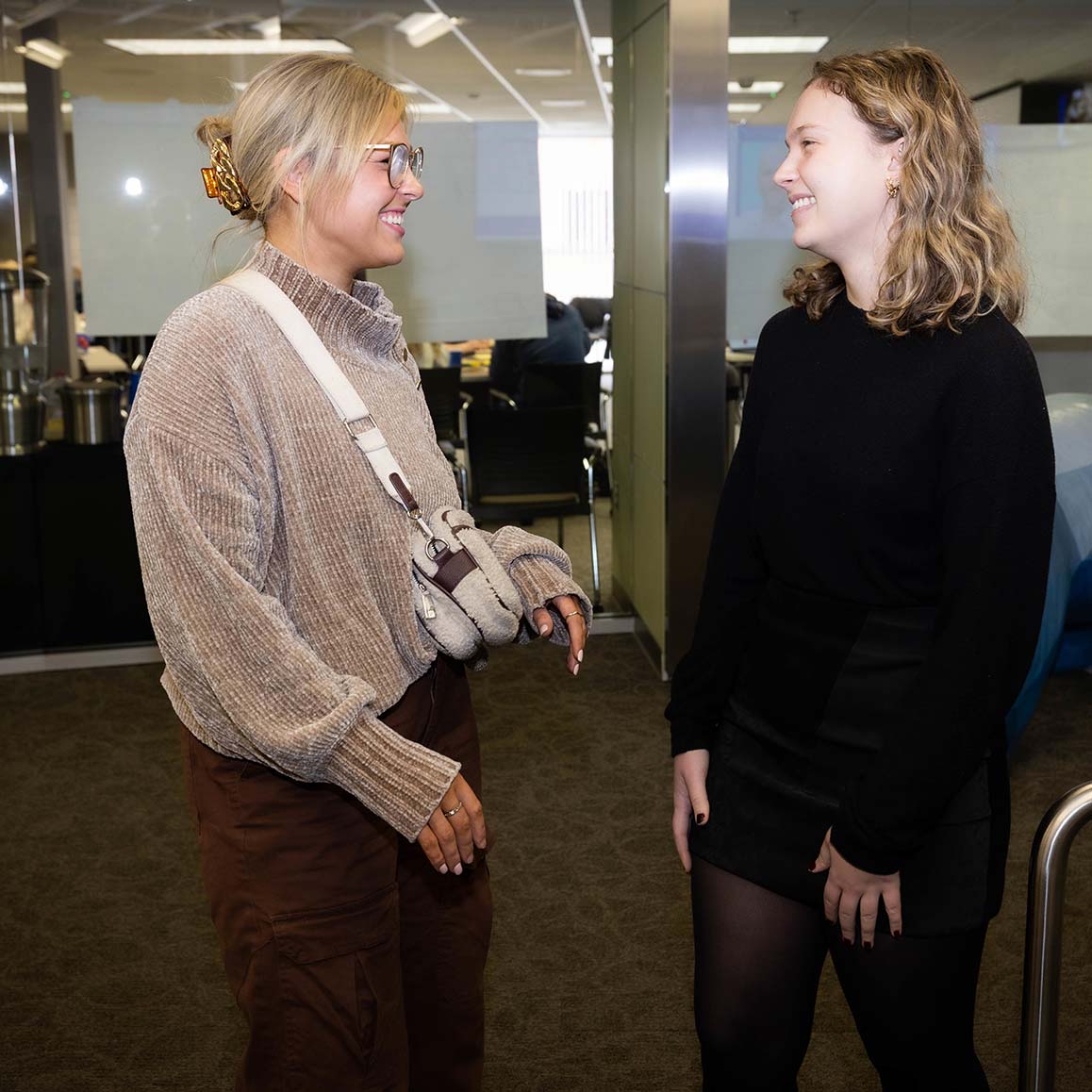 Two Missouri State University graduate assistants within the workplace. 