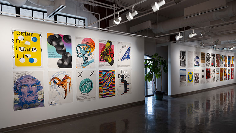 Display of colorful artwork within the Brick City Gallery.