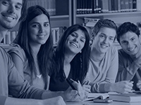 five students sitting at table
