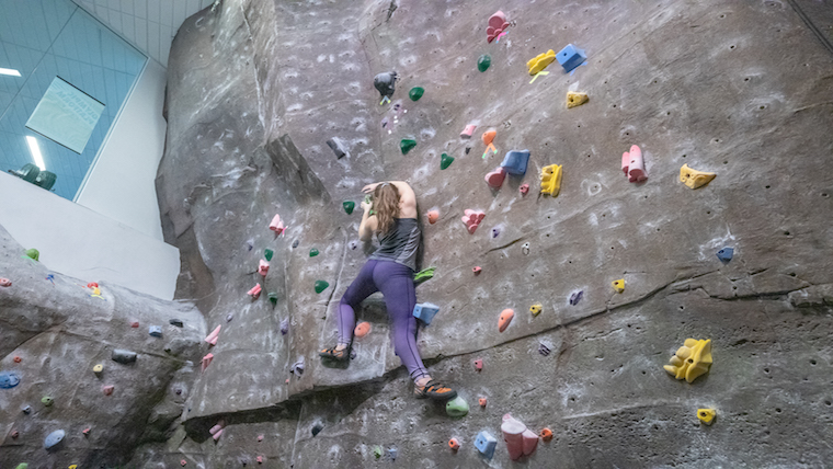 Overhead view of the indoor rock climbing wall inside the Foster Recreation Center