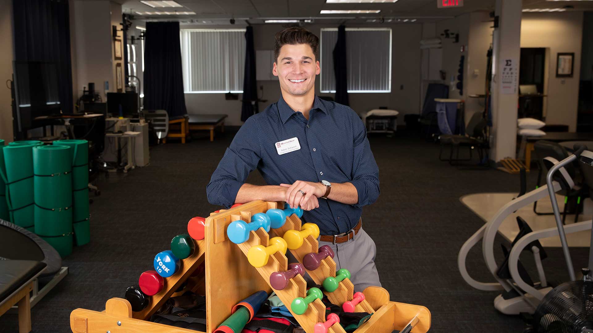 Physical therapy student posing in the Physical Therapy Clinic.