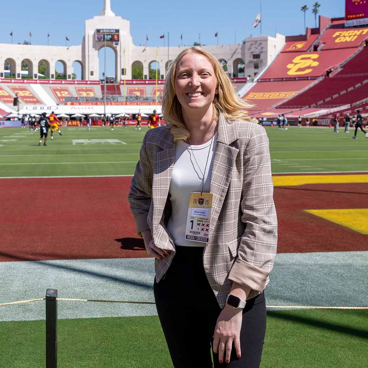 A sports information director on the field pregame at LA Memorial Coliseum.