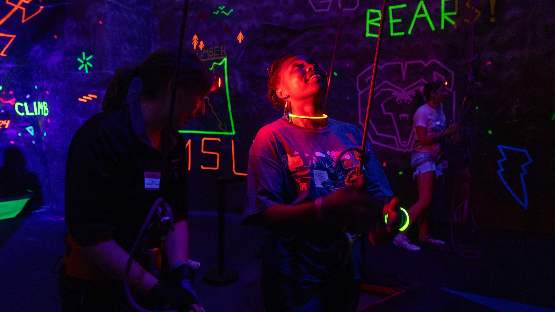 Glow Climb (glow-in-the-dark rock climbing) at Foster Recreation Center.