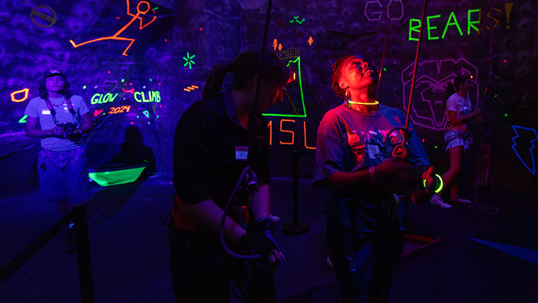 Glow Climb (glow-in-the-dark rock climbing) at Foster Recreation Center.