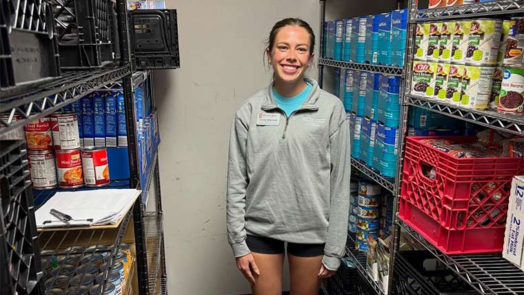 A nutrition and dietetics student taking inventory at Bear Pantry.