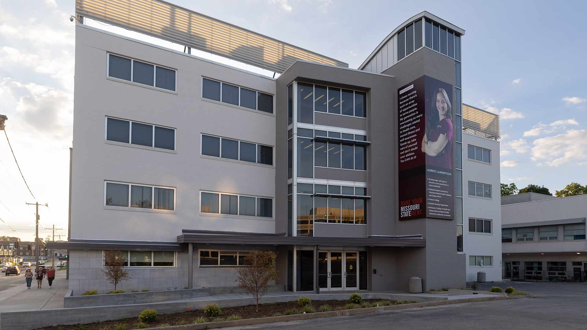 Exterior of Ann Kampeter Health Sciences Hall at sunset.
