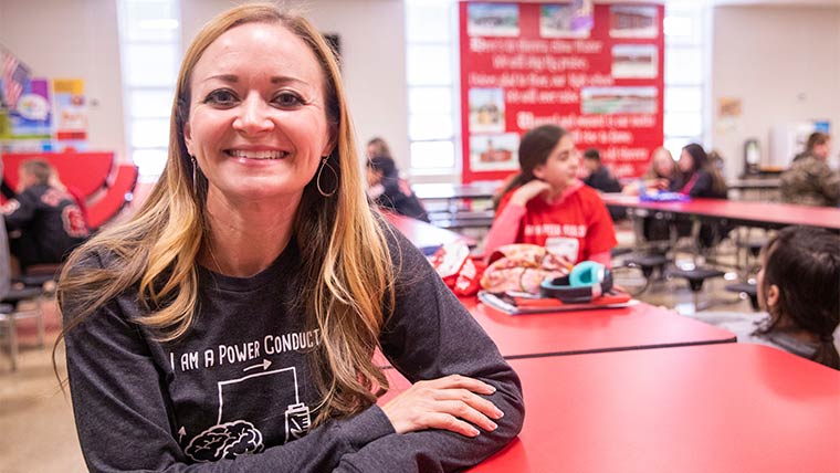 Dr. Leslie Echols, psychology professor, in an elementary school lunchroom.