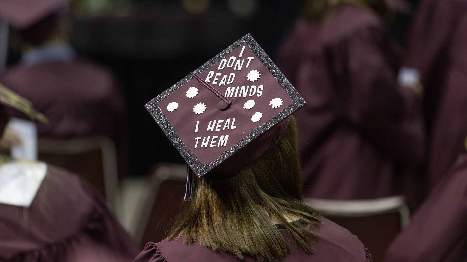 A  commencement motor board with the message: I don't read minds. I heal them.