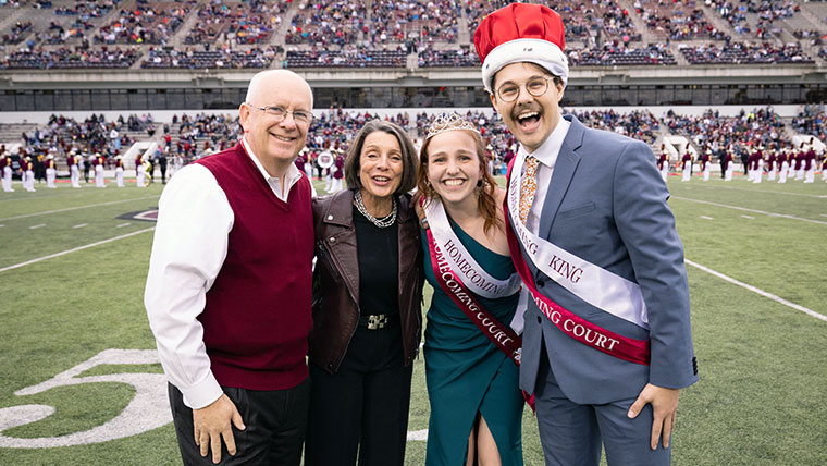 President Smart and his wife Gail with the homecoming king and queen. 