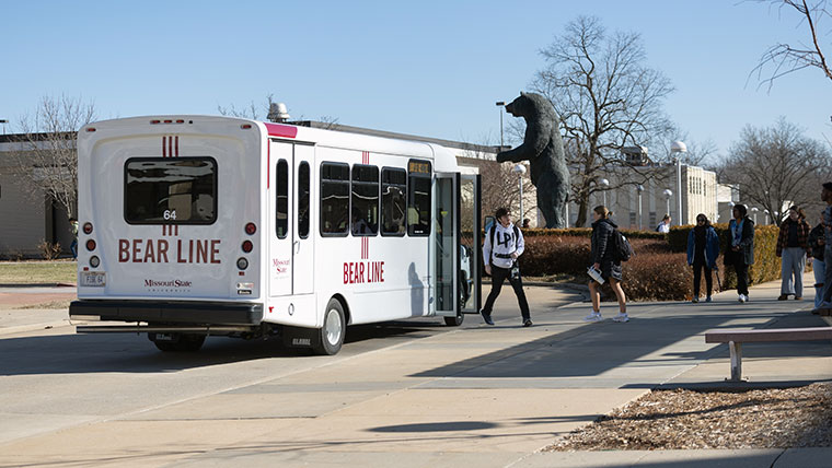 Missouri State students entering and exiting a Bear Line shuttle.