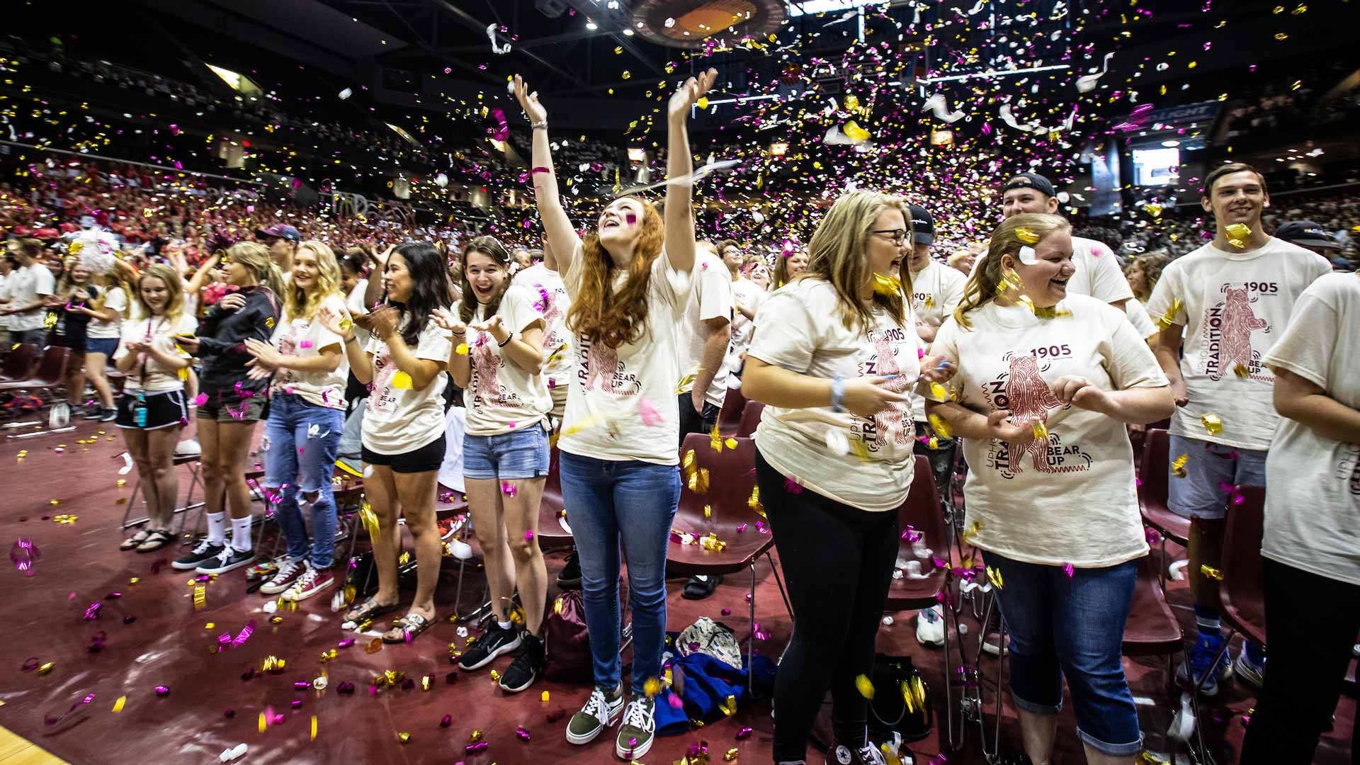 Students enjoy confetti falling from the rafters at Great Southern Bank Arena.