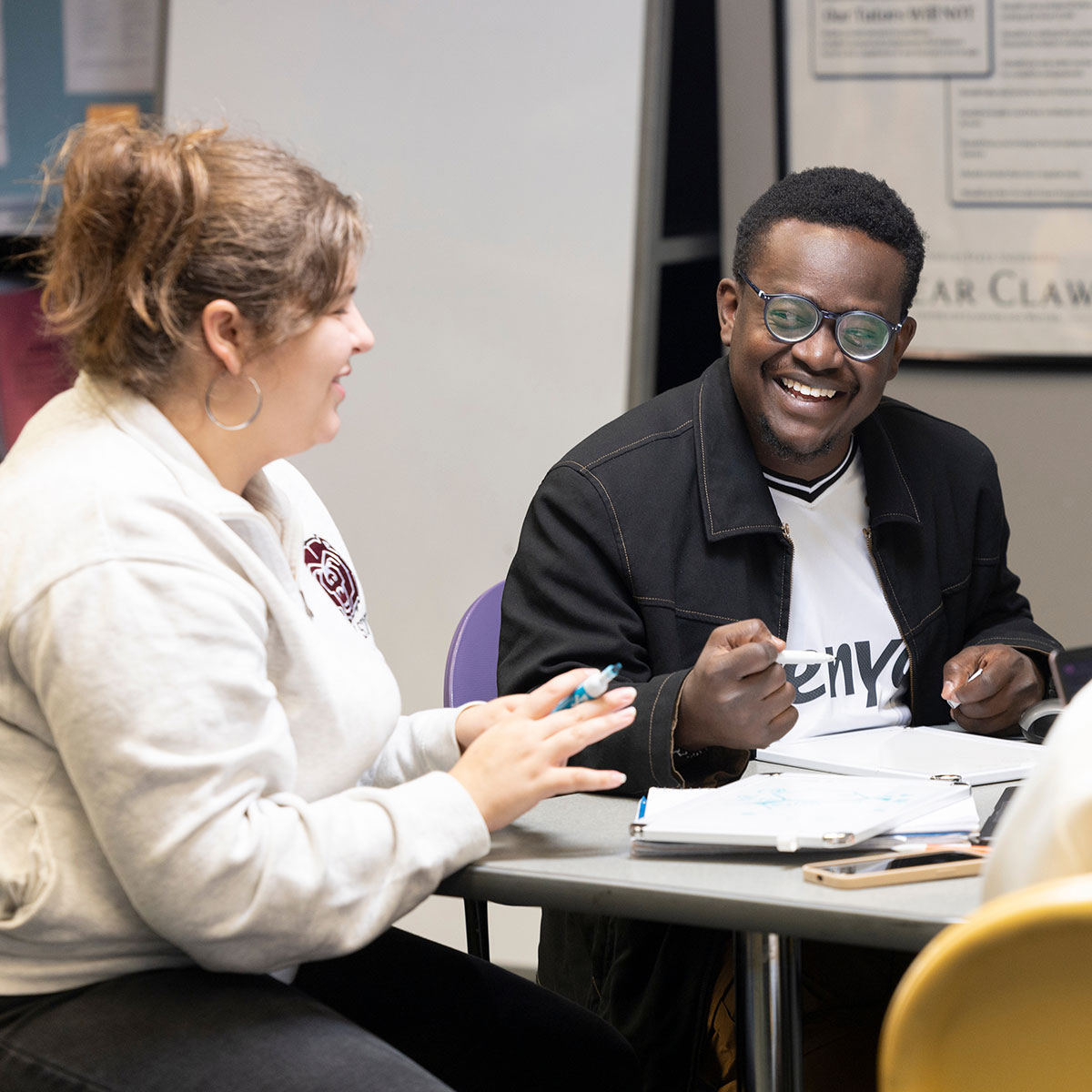 Two students in a study group at the Bear CLAW discuss their notes.