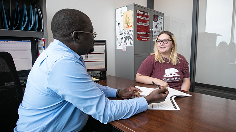 Missouri State advisor assisting a student. 