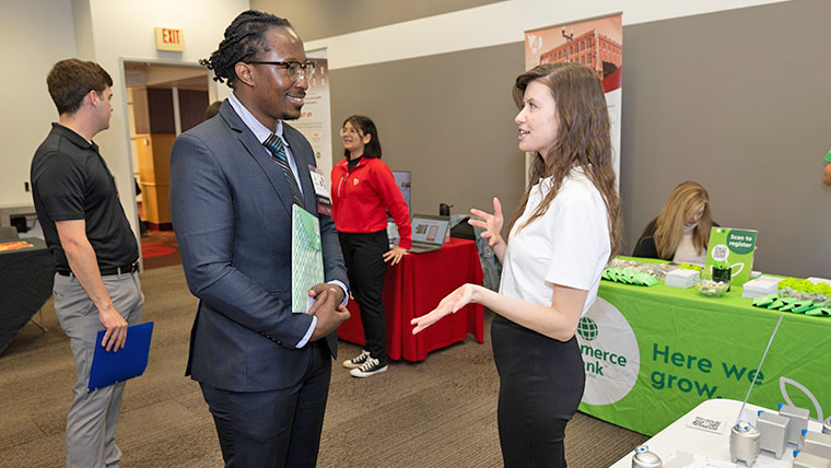 Student talking to a prospective employer.
