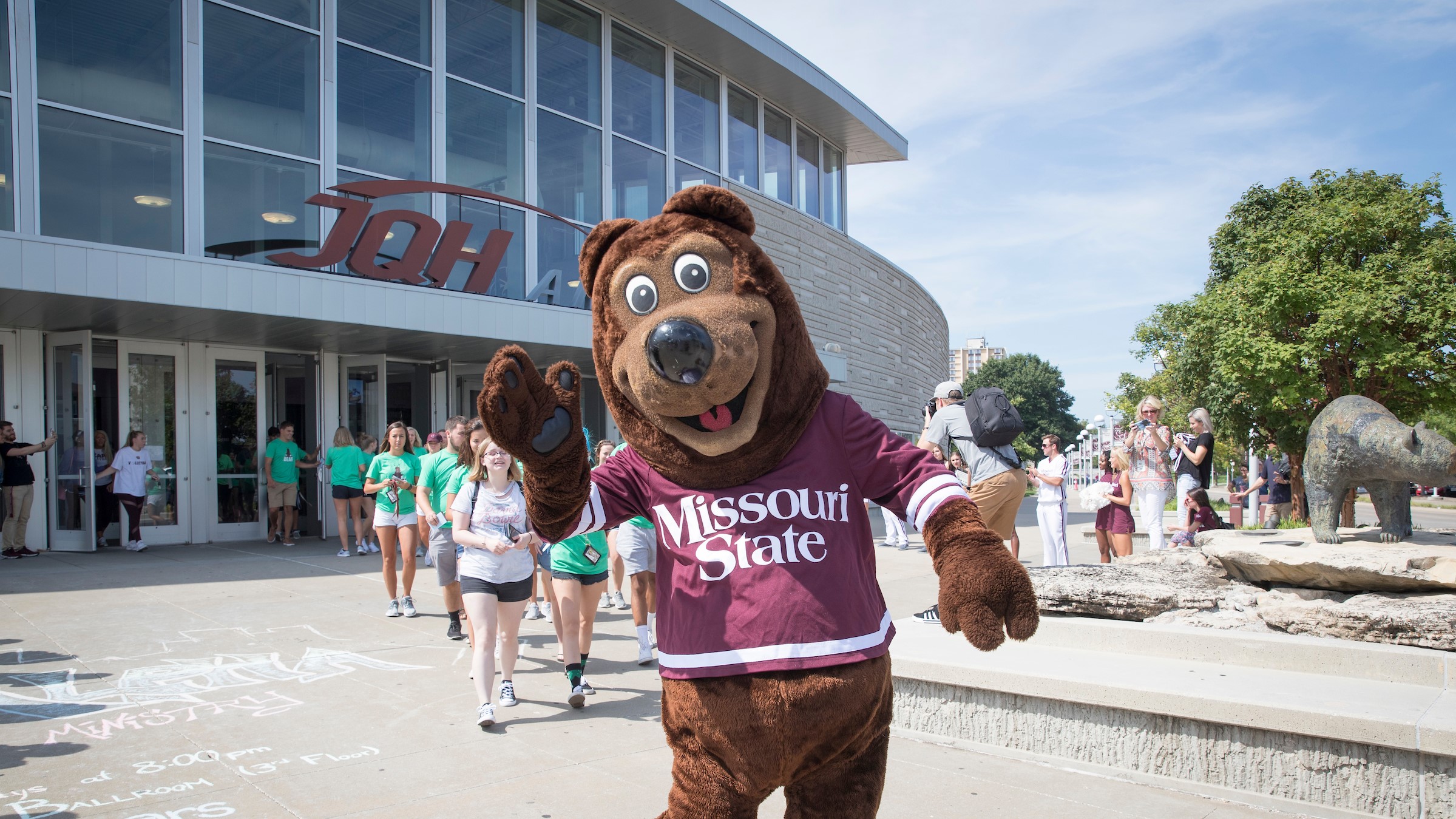 Boomer waves hello to new students.