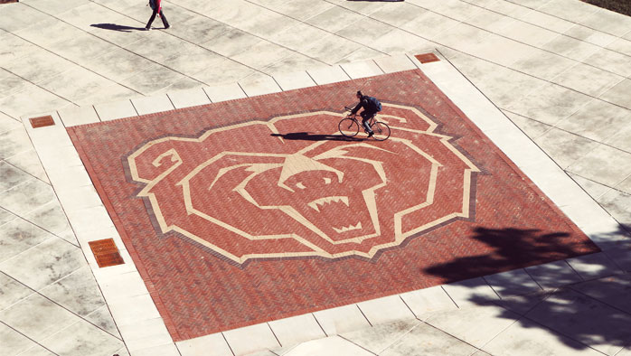 MSU Bear logo on sidewalk