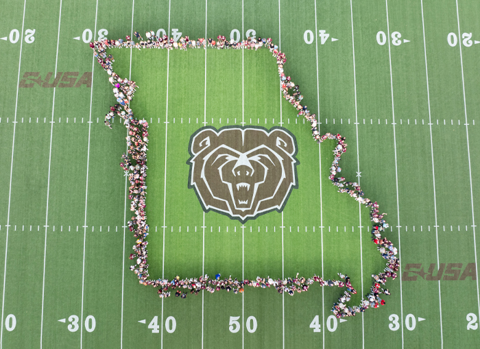The Class of 2029 takes a photo on the Bear Head at Plaster Stadium