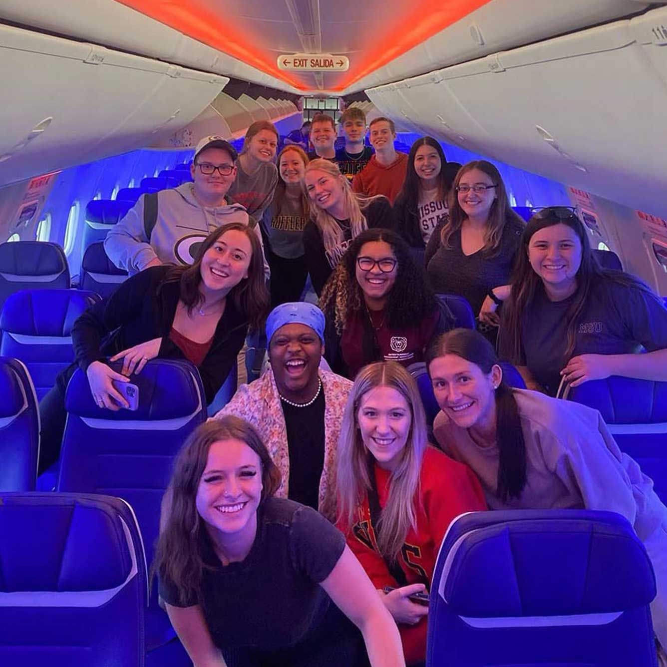 Entertainment management students on board their flight to Super Bowl 57 in Glendale, Arizona.