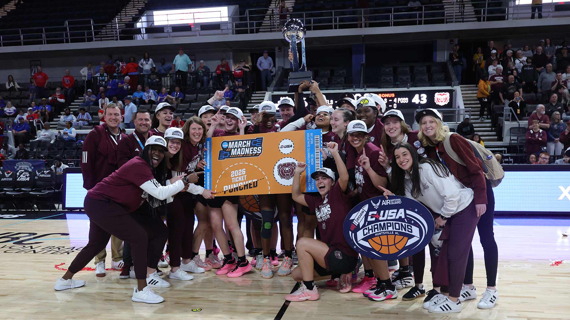 Lady Bears pose for a group after winning the Conference USA Tournament.