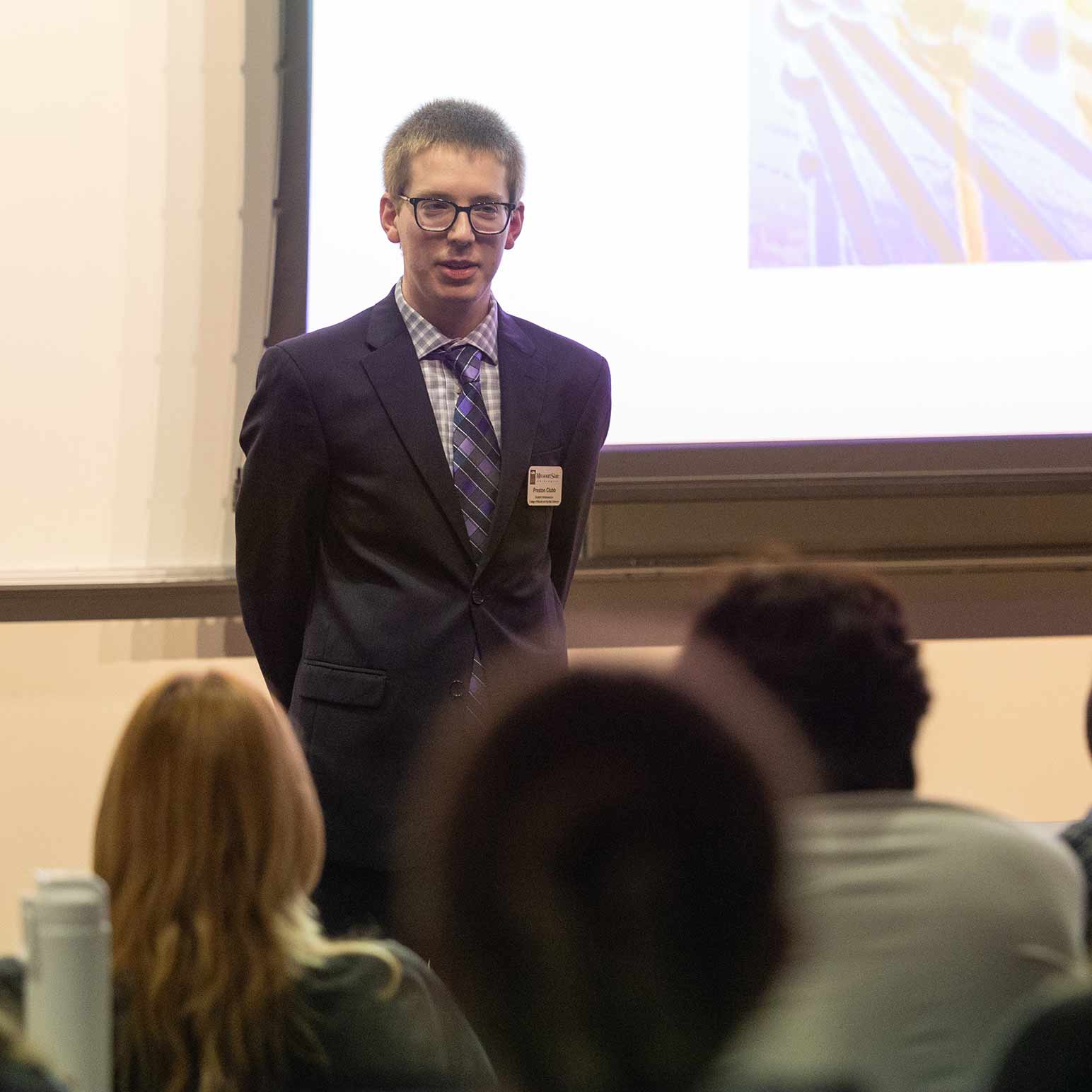 Chemistry student Preston Clubb giving a research presentation.