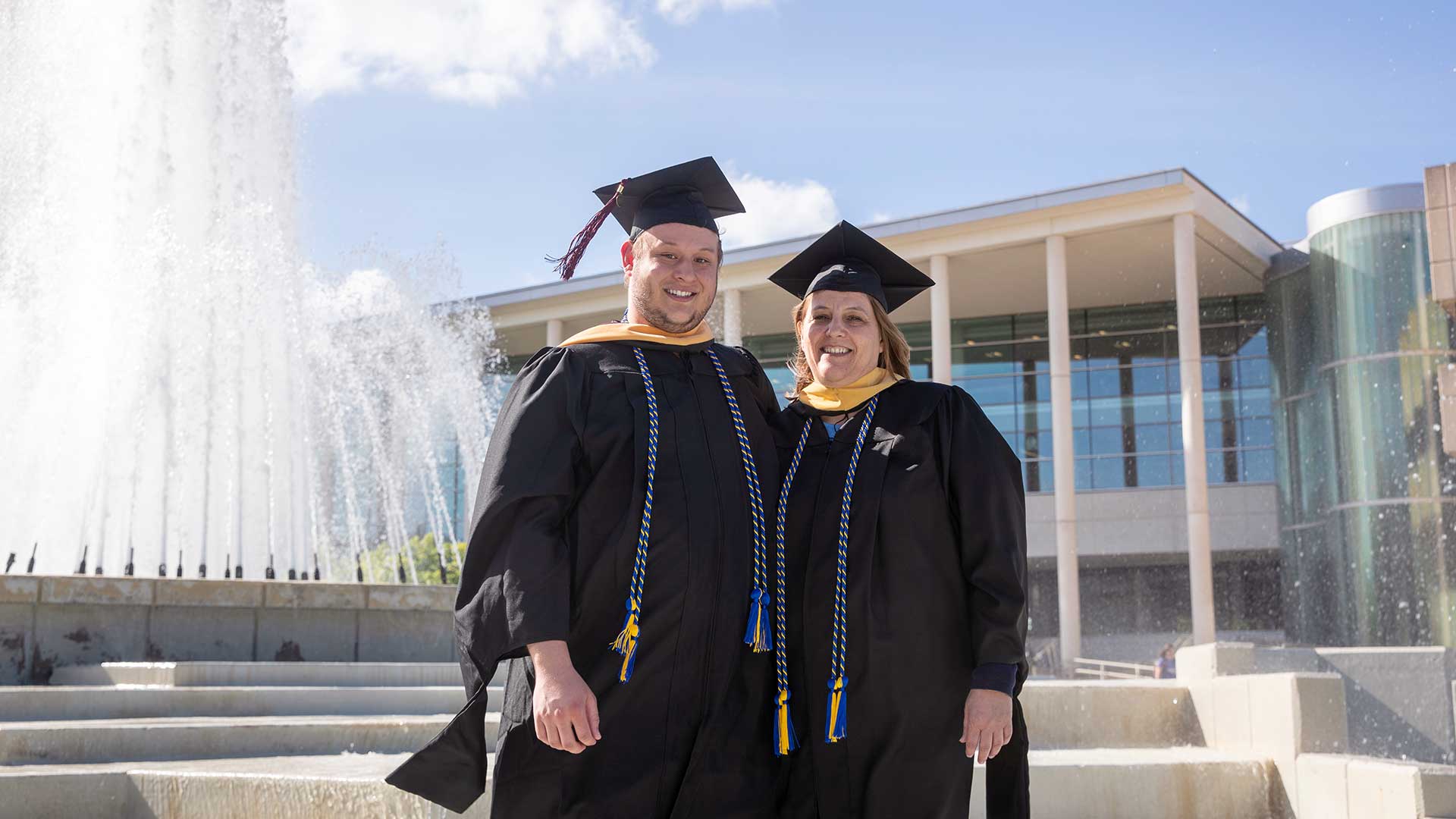 Mother and son graduate with Master’s Degrees in Social Work within the same ceremony.