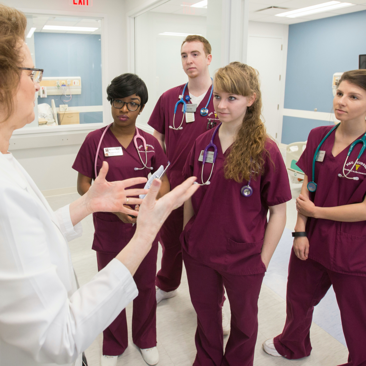 Group of nursing students receiving instruction