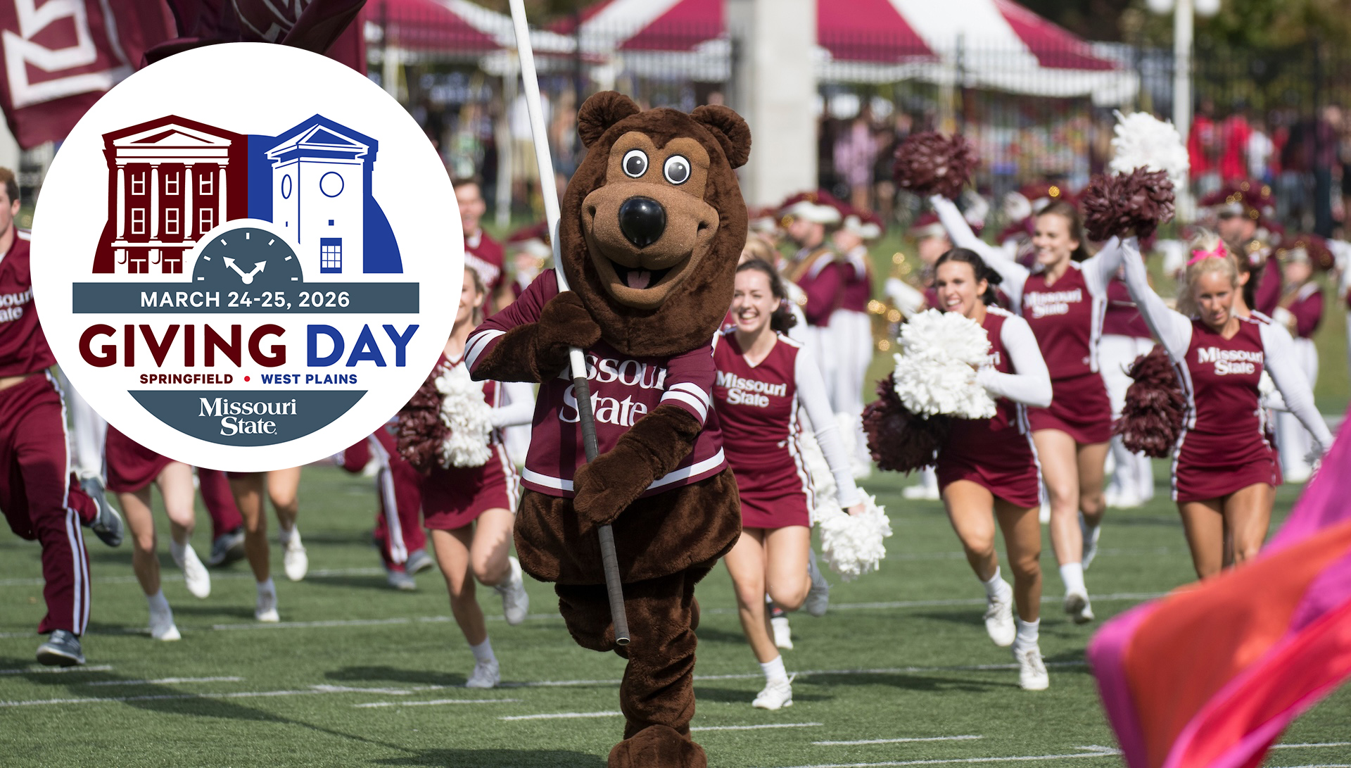 Celebrating with students and cheerleaders in support of Mo State giving day. 